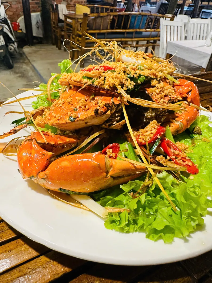 Crab stir-fried with garlic, chili and lemongrass on a bed of lettuce